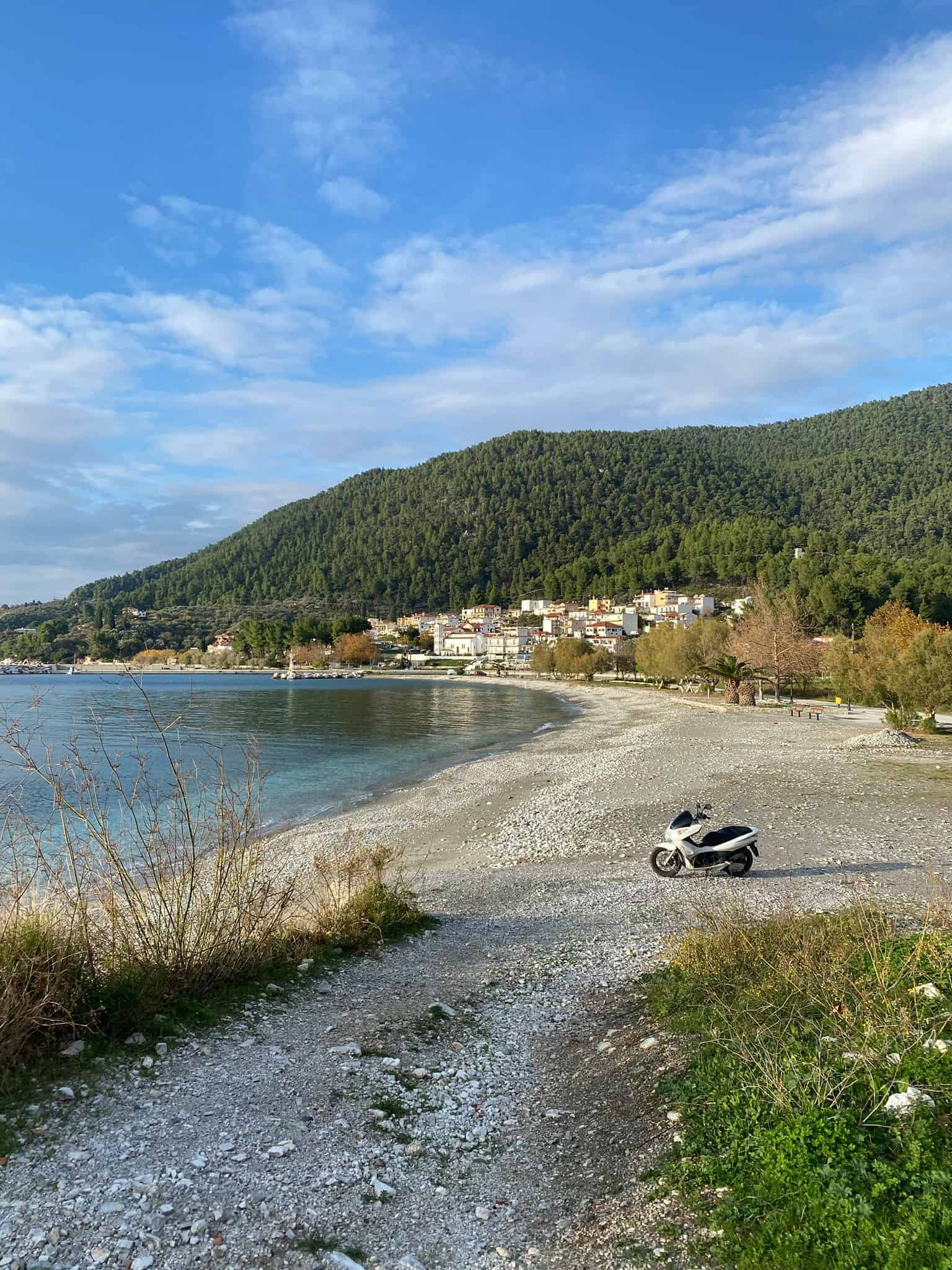 A motorbike parked on the beach