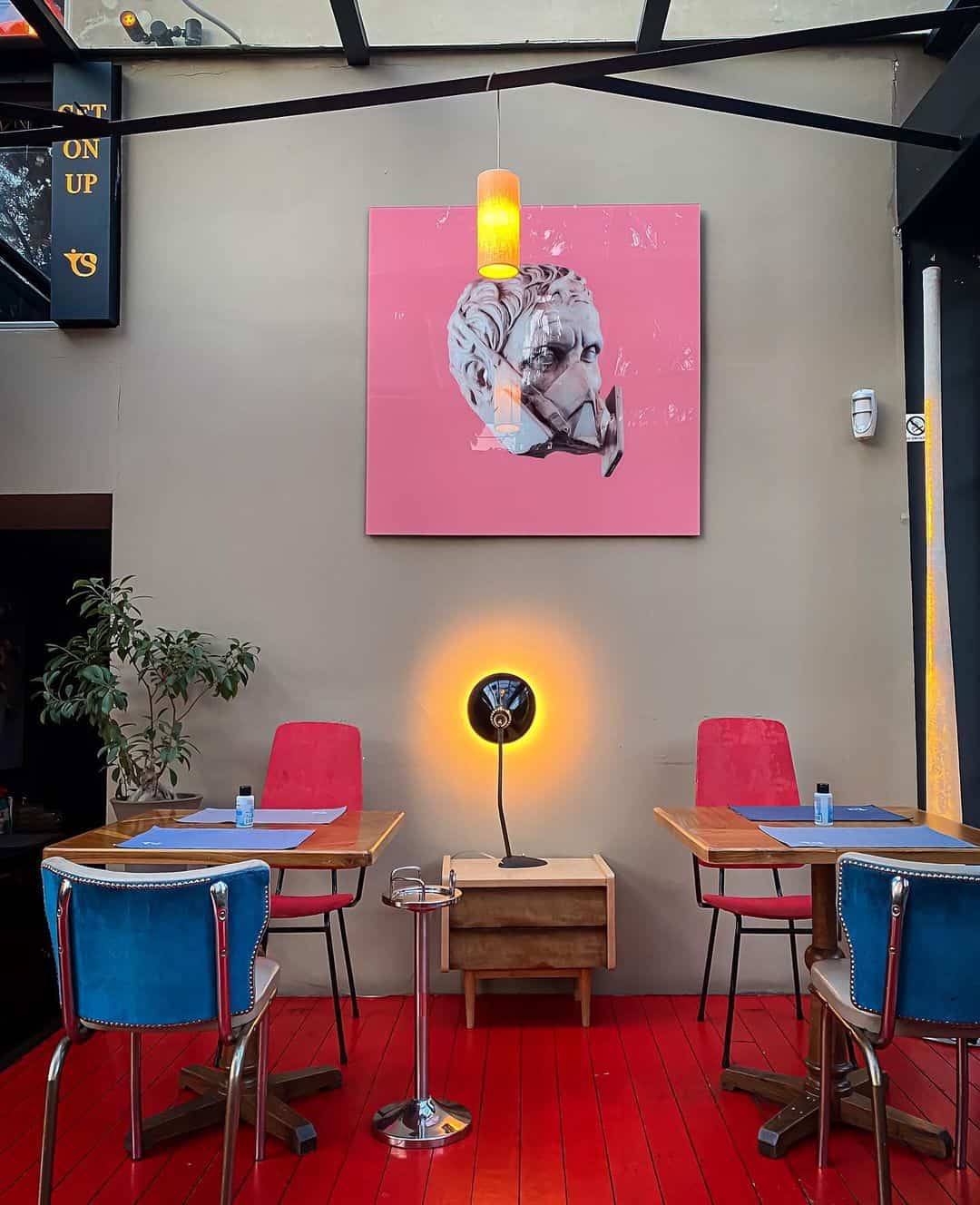 Interior of a restaurant showcasing a bold red floor