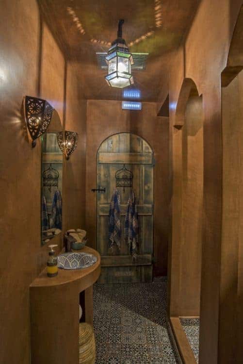 A contemporary bathroom scene with a sleek sink and a mirror