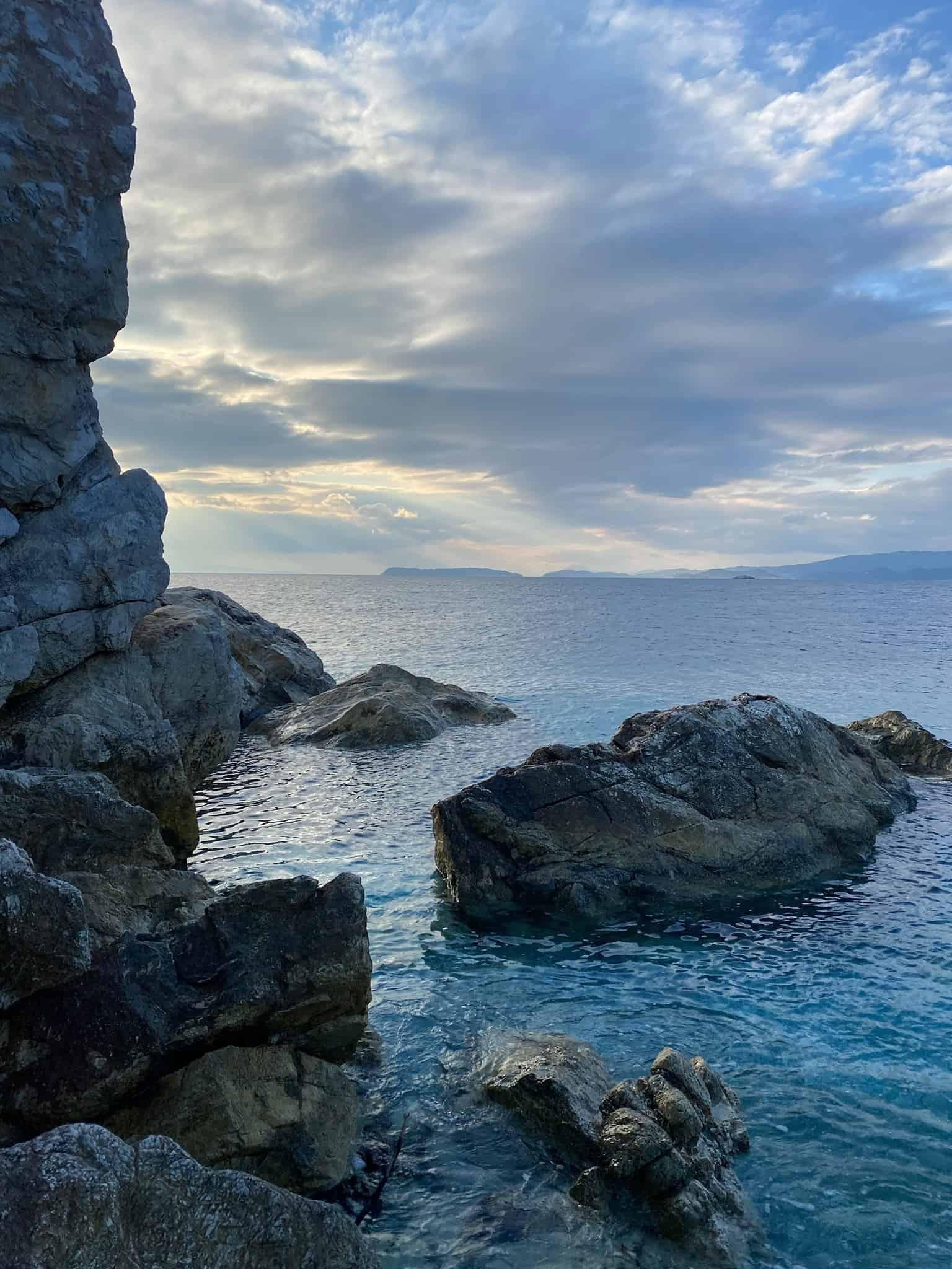 A serene view of rugged rocks lining the shoreline