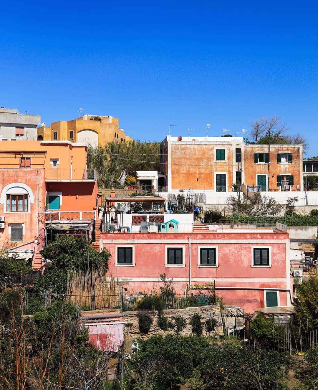 Vibrant houses dot the hillside in Naples