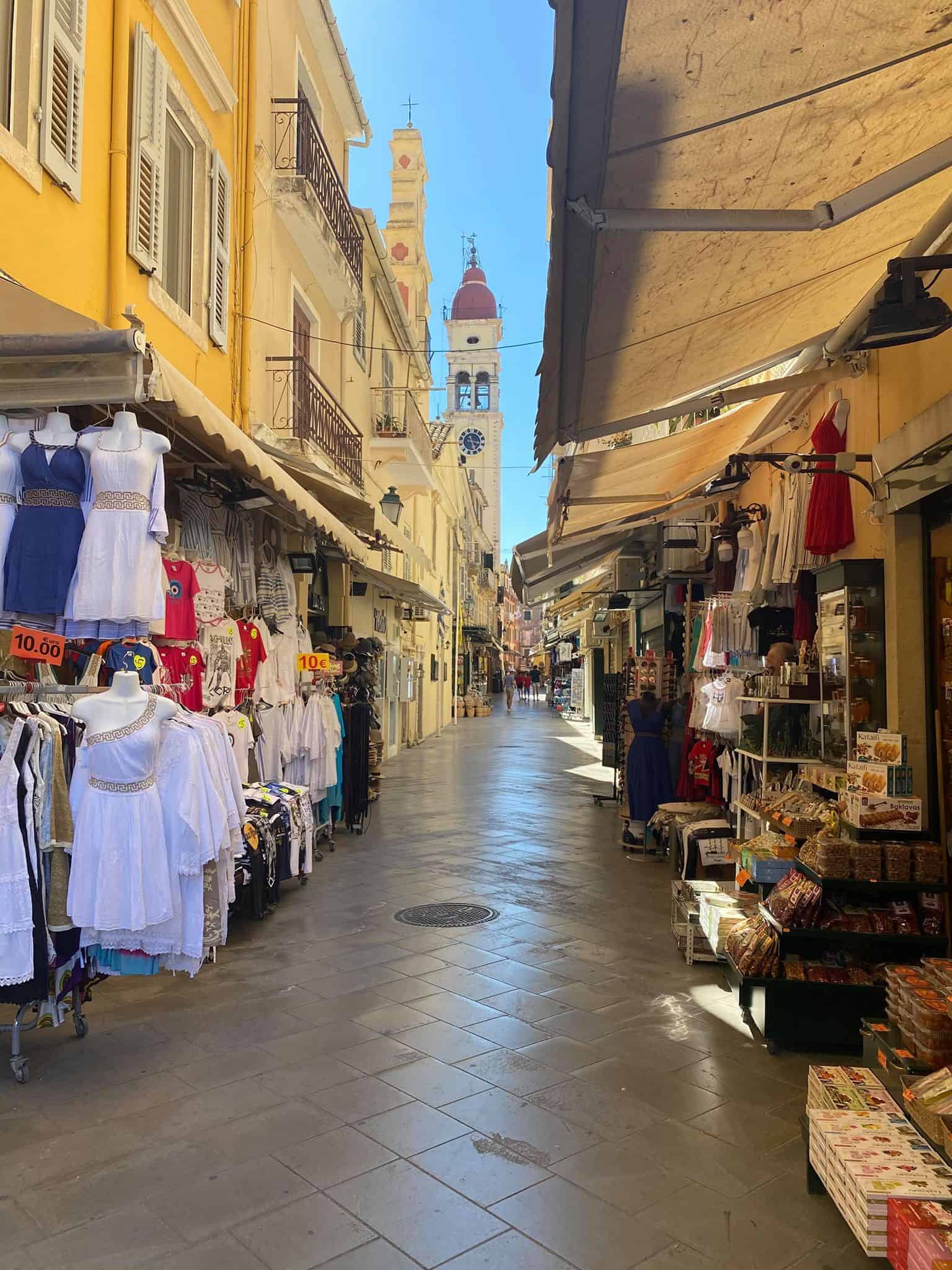 A bustling narrow street lined with shops