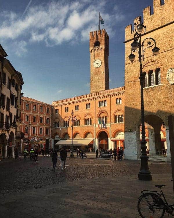 A substantial brick building with a clock tower and clock