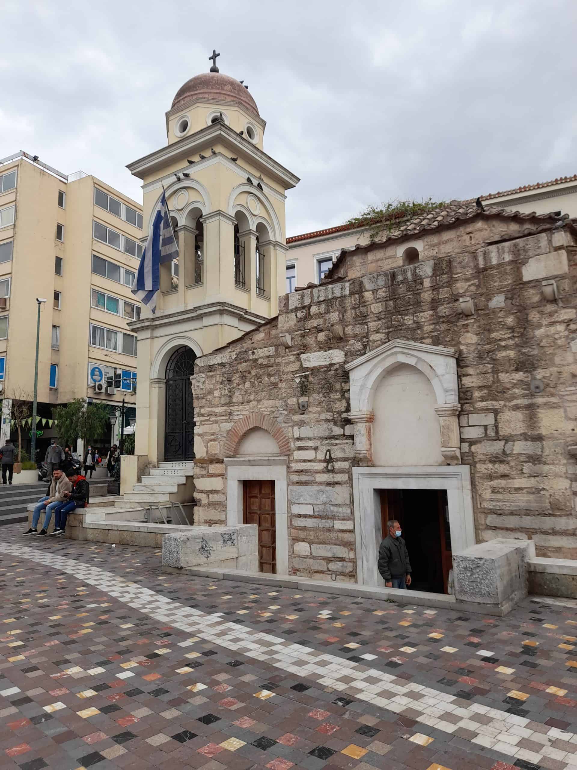 A church featuring a prominent bell tower alongside an elegant clock tower