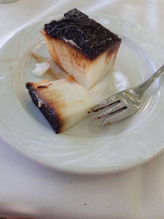 A slice of cake on a white plate