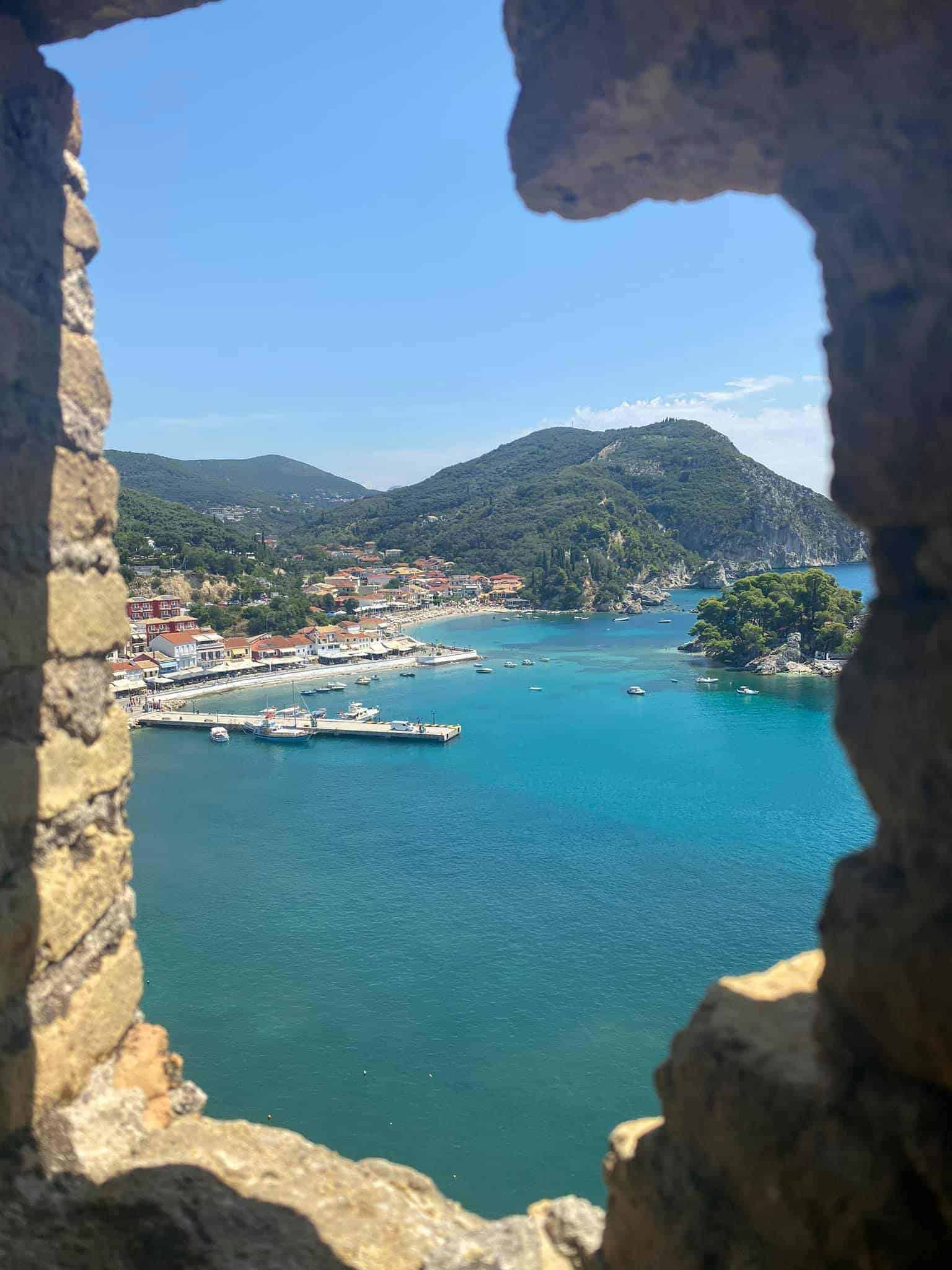 A scenic view of the bay framed by an ancient stone wall