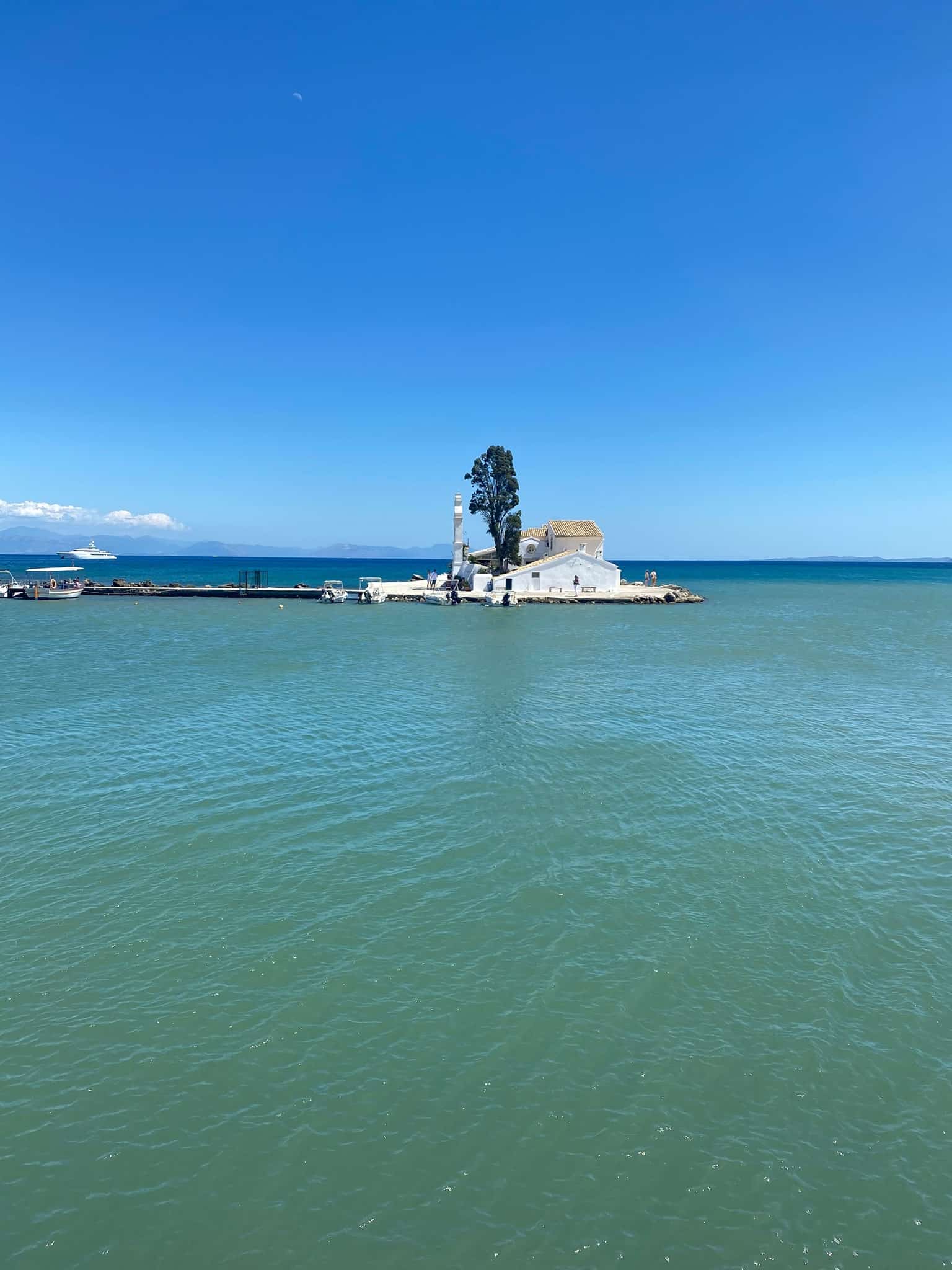 A serene small island surrounded by vast ocean waters