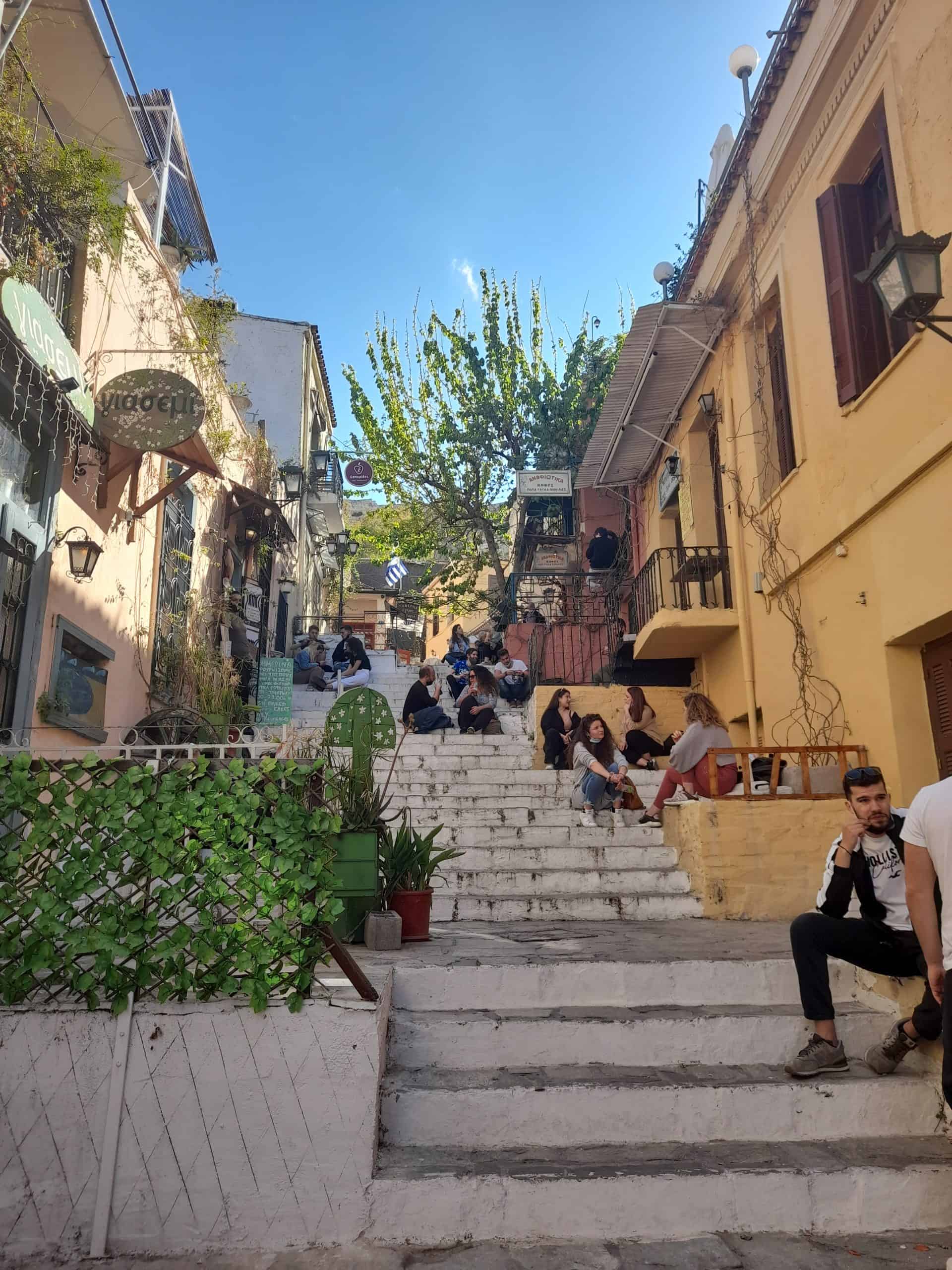 Several people gathered on the steps of a city building