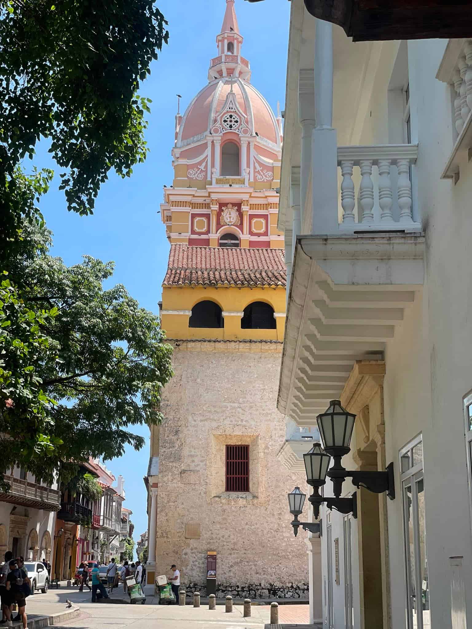 A scenic image featuring a church tower prominently positioned within the city