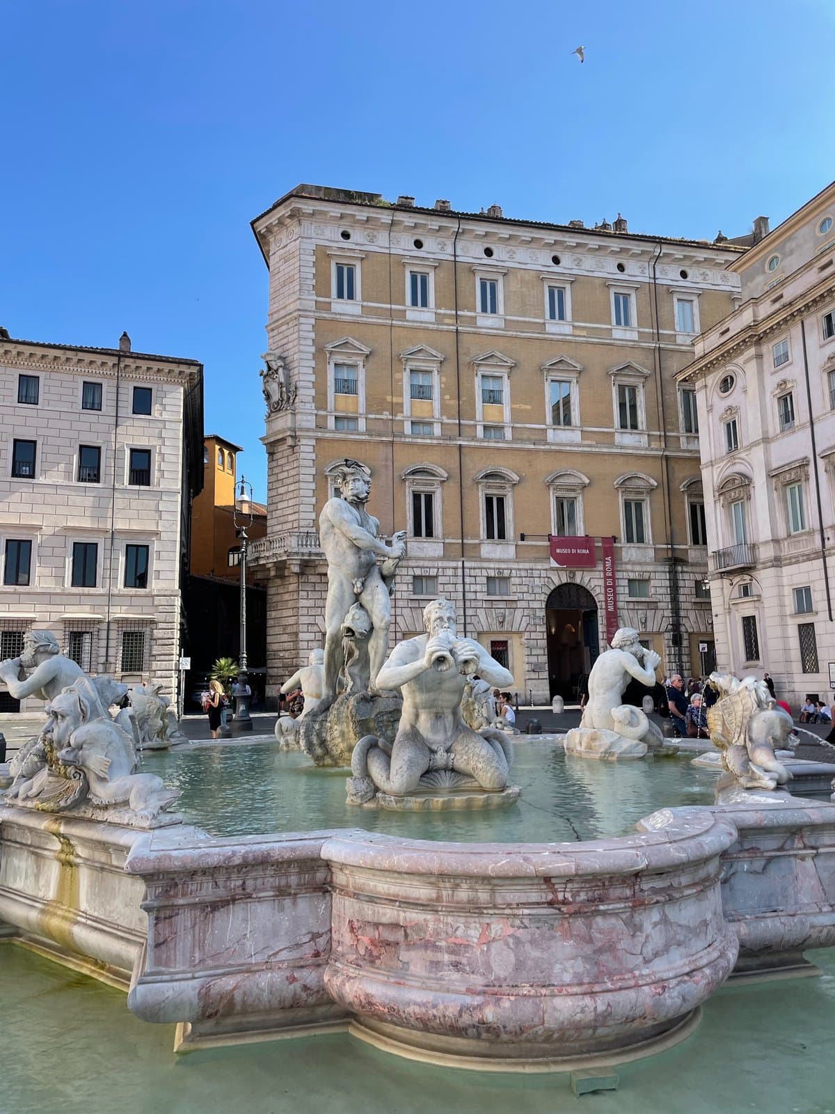 The stunning fountain at Piazza del Campo in Rome, showcasing intricate design amidst the lively square's historic charm