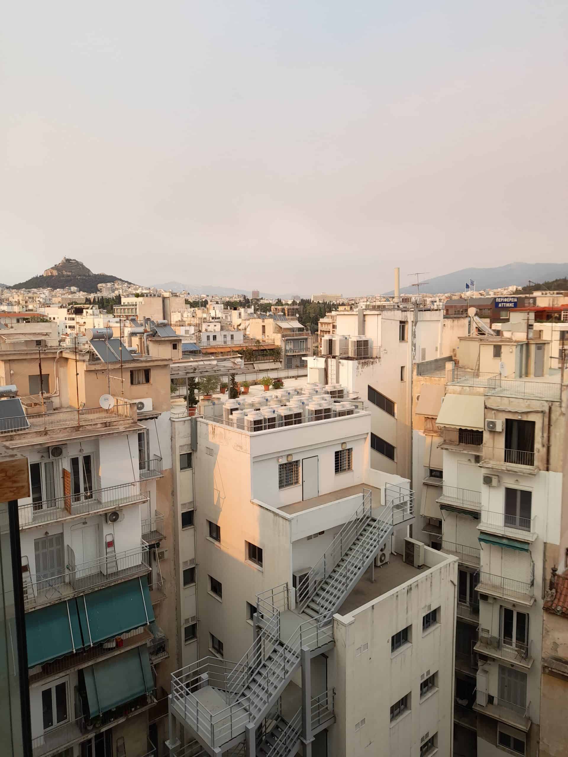 A panoramic view of the city skyline from a balcony