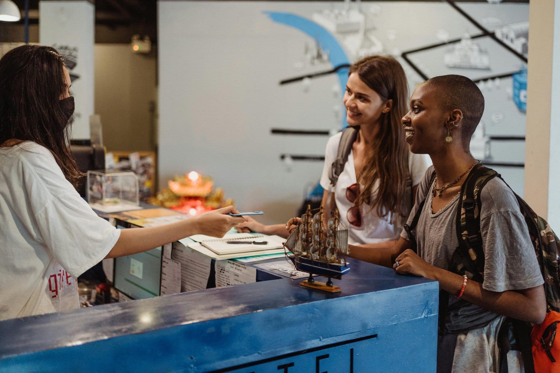 A woman actively engaging with guests and offering support.