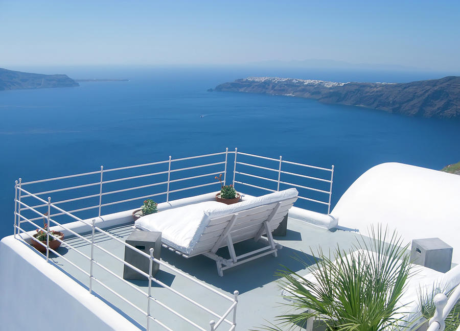 A white couch positioned on a balcony