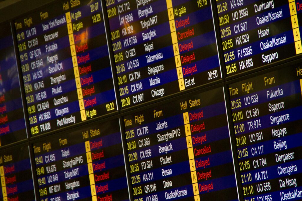 Boarding schedule screen in airport showing flights