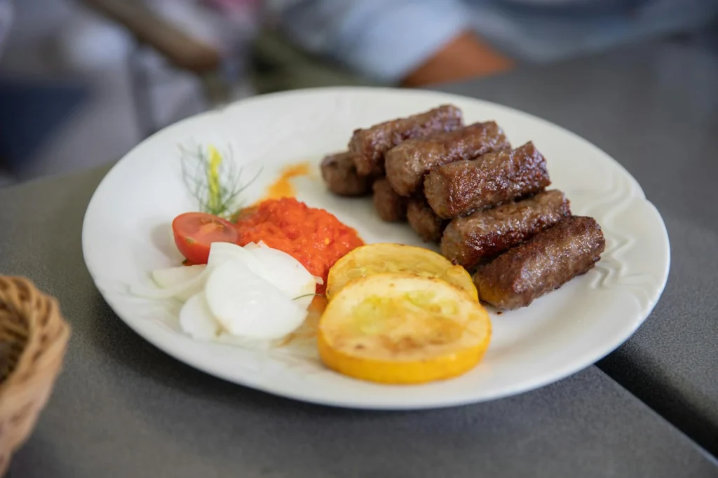 Kranjska klobasa sausage with vegetables, showcasing traditional Slovenian cuisine