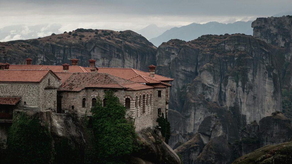 Monastery perched on towering rock formations in Meteora, Greece, blending stunning architecture and natural beauty