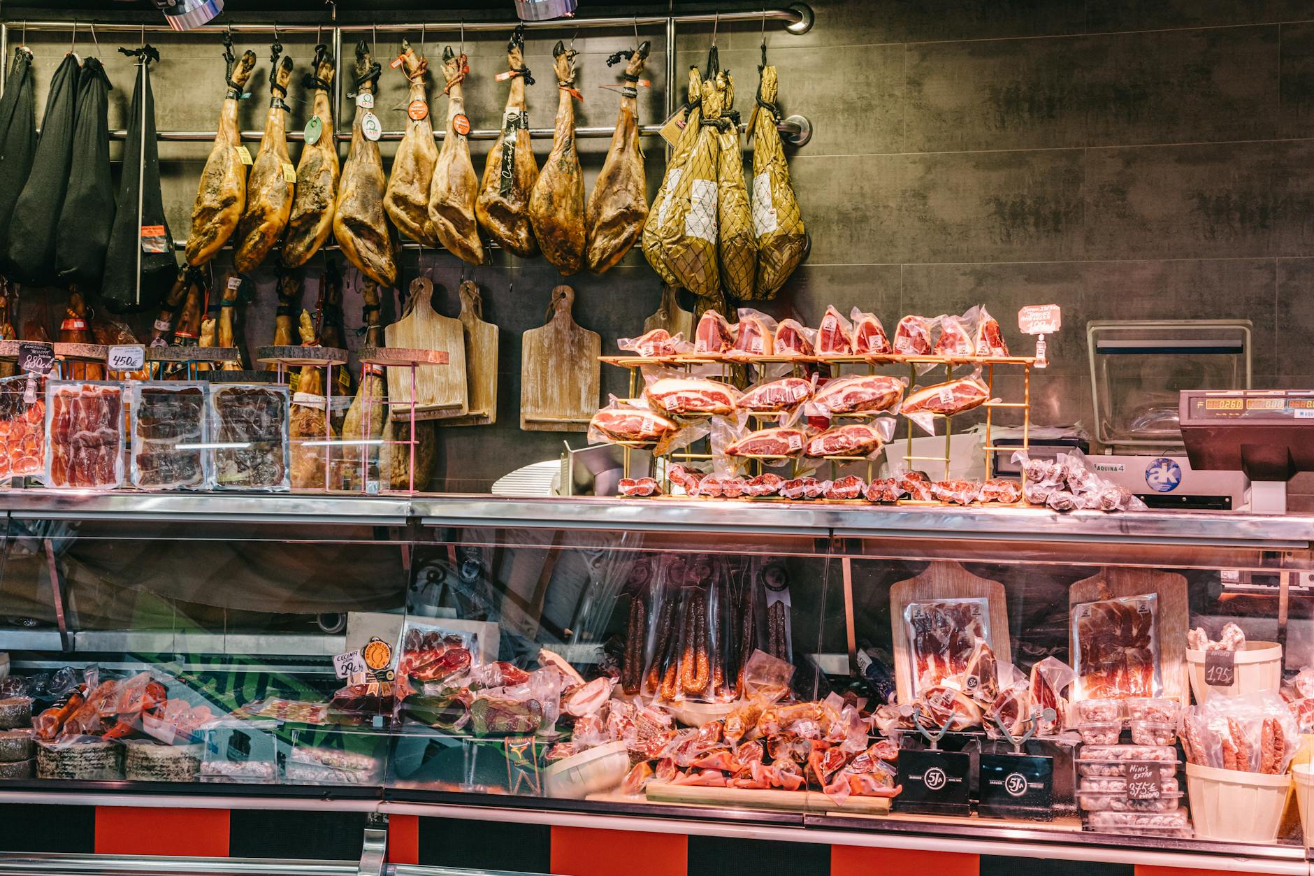 Traditional Spanish meats displayed in a butcher shop, showcasing authentic European culinary traditions