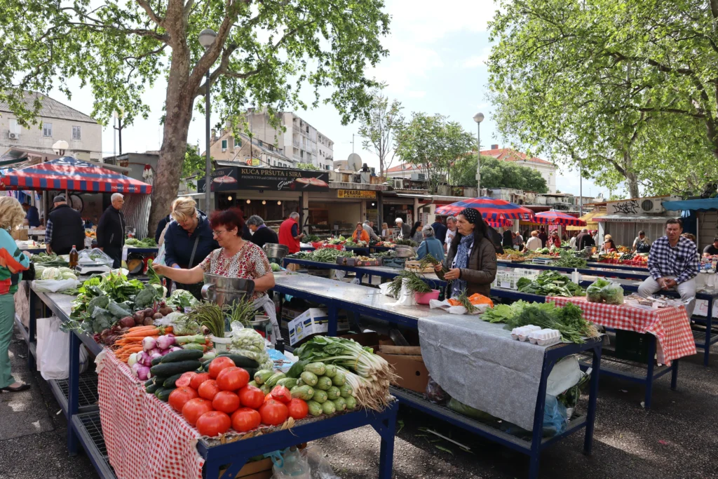 Vibrant local market with fresh produce and spices, capturing authentic European food culture