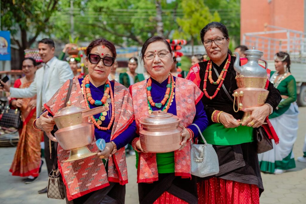 Women in traditional attire celebrating a cultural festival, showcasing heritage and vibrant community traditions.