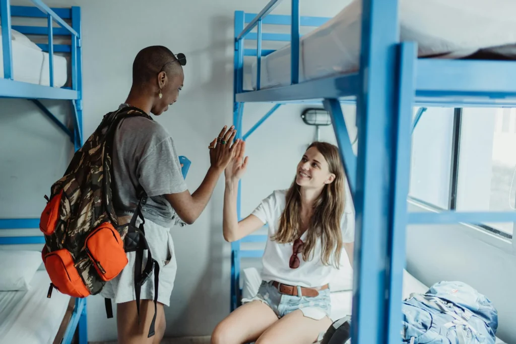 two tourists at an airbnb room