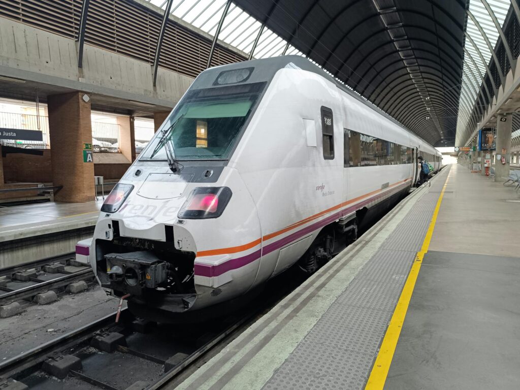 A sleek, modern train at Sevilla Santa Justa railway station in Spain