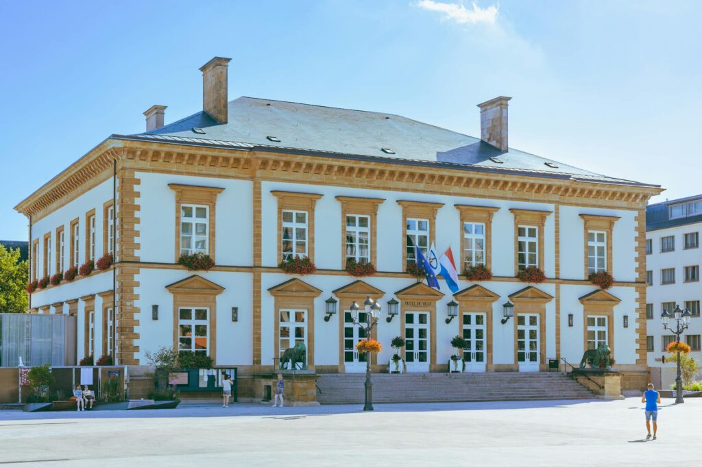 A sunny day at Luxembourg City Hall showcasing its elegant architecture and vibrant surroundings.