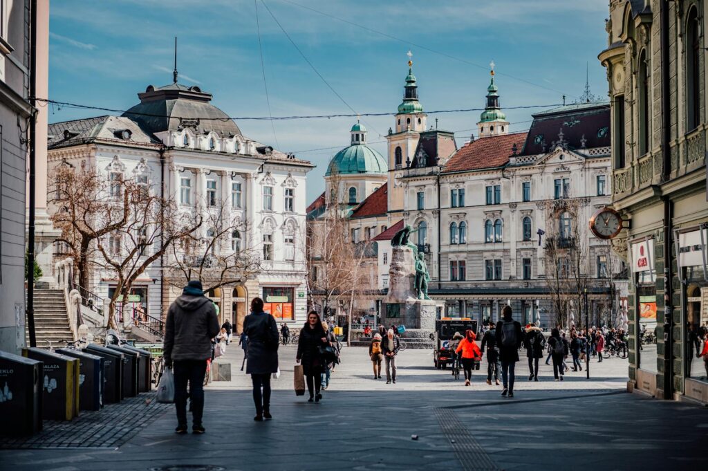 Explore the vibrant city center of Ljubljana, Slovenia with its historic architecture and lively atmosphere.