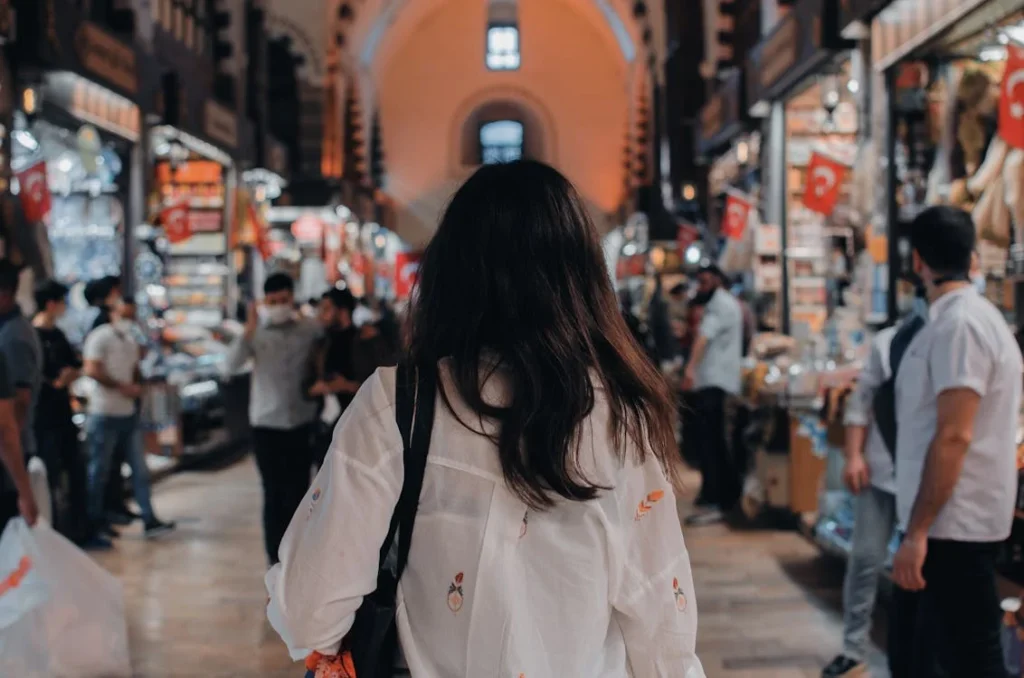 a woman strolling in a market