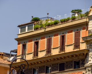 Classic residential Italian building against the sky in Rome