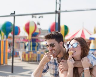 Couple eating ice cream cones, Coney island, Brooklyn, New York, USA