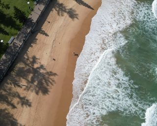 Drone shot of a surfer at Manly Beach