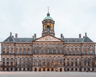 Empty Dam Square during the end of the day Royal Palace Amsterdam Netherlands