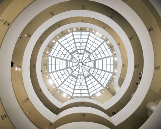 Low angle shot of a beautiful round glass roof in Solomon R. Guggenheim Museum, New York