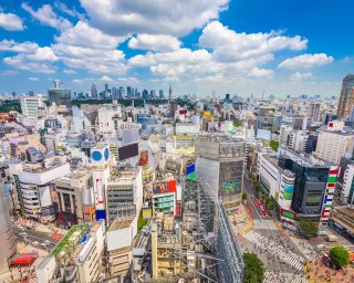 Shibuya, Tokyo, Japan city skyline over Shibuya Scramble Crosswa