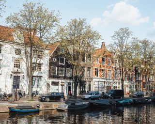 Storehouses in Amsterdam The Netherlands with bicycle on foreground