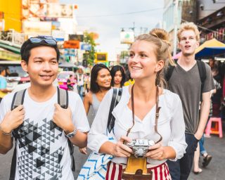 Thailand, Bangkok, Khao San Road, portrait of friends exploring the city