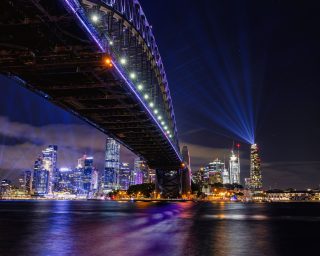 Vertical shot of a Sydney Harbour Bridge at night in Australia